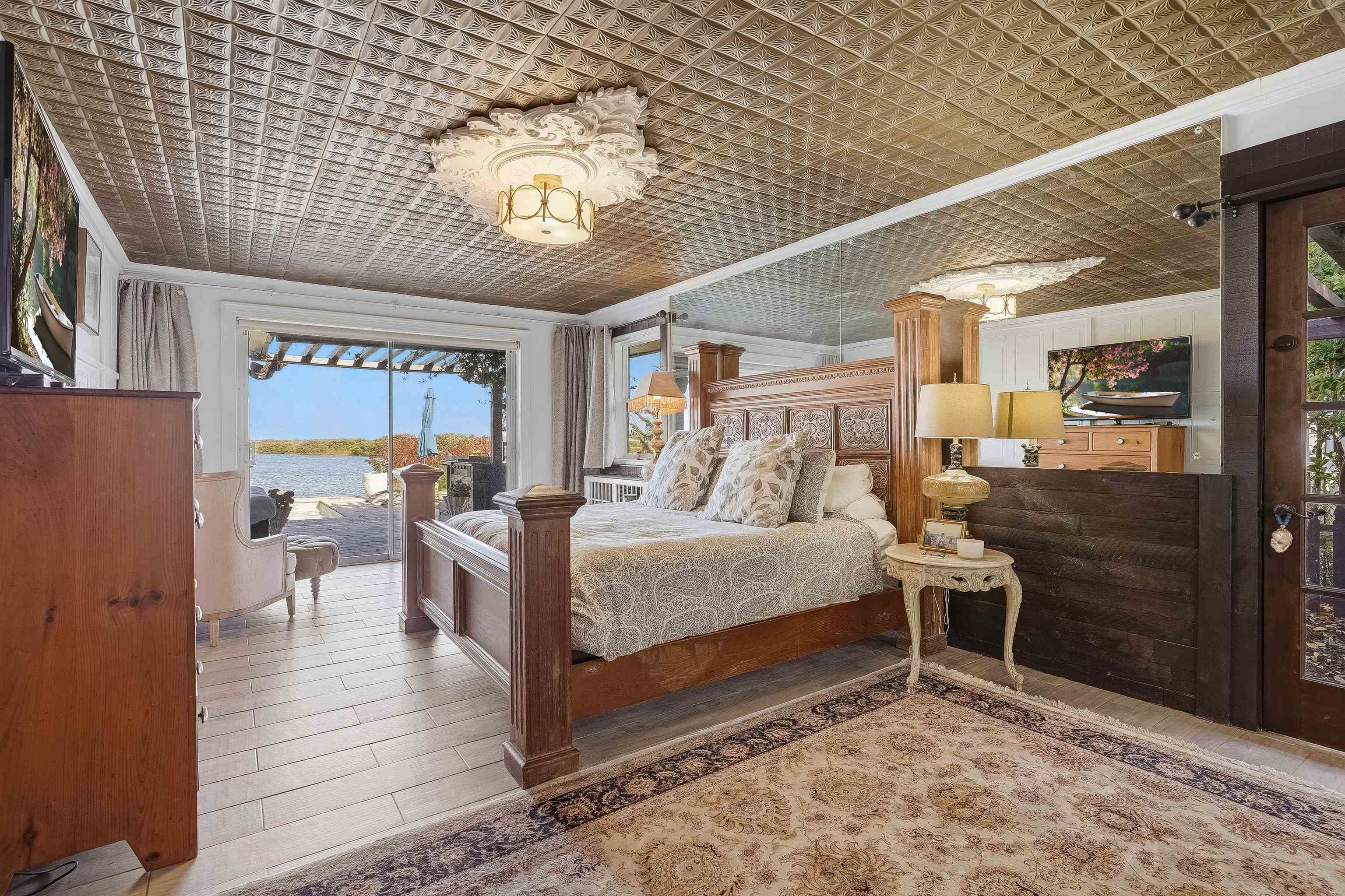 71 Water Street St. Augustine, FL 32084 - Photo 24 of 58 Bedroom featuring gorgeous water views and access to the pool and patio area.