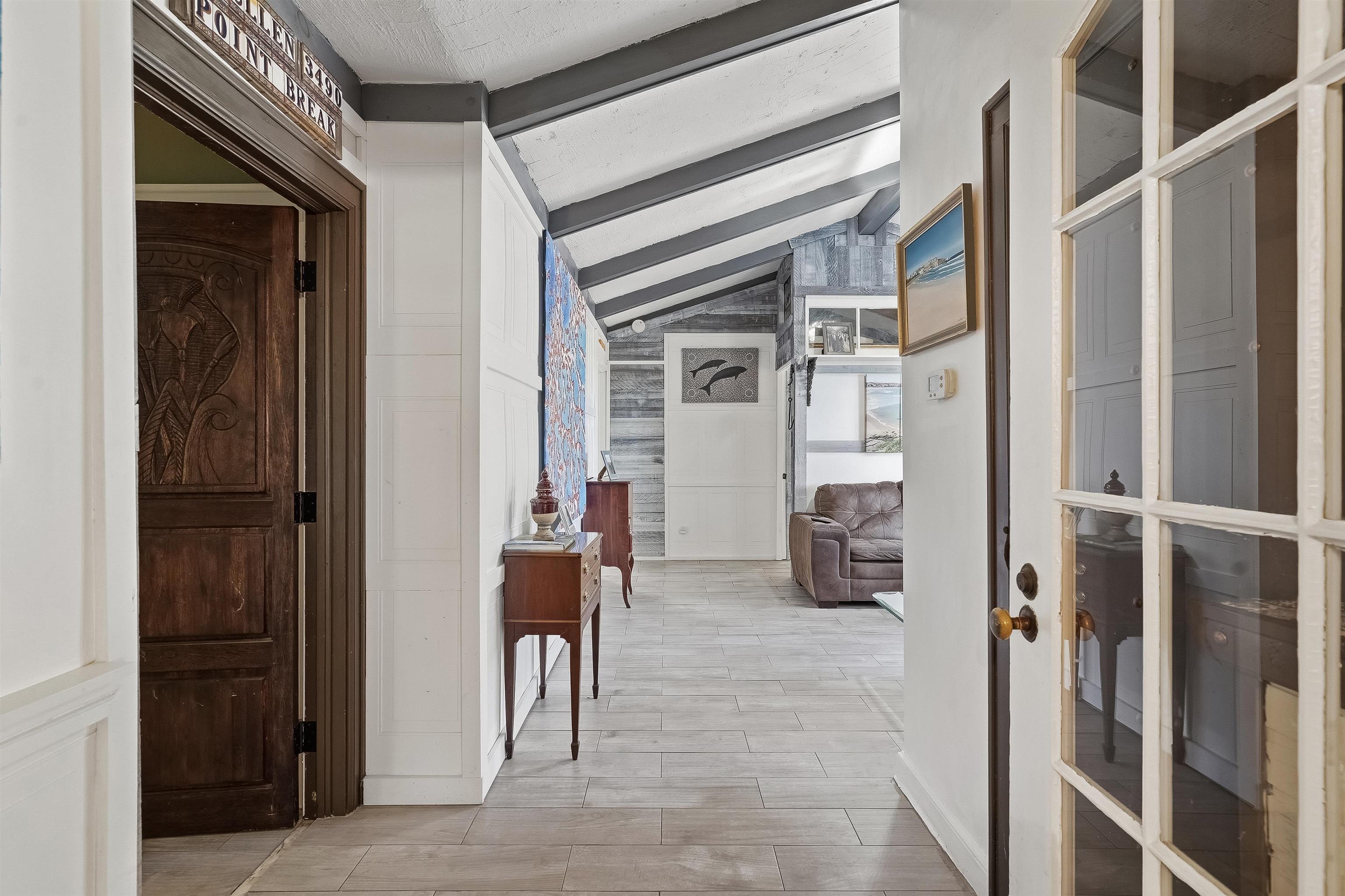 71 Water Street St. Augustine, FL 32084 - Photo 31 of 58 Corridor featuring vaulted ceiling with beams and wood tiled floors