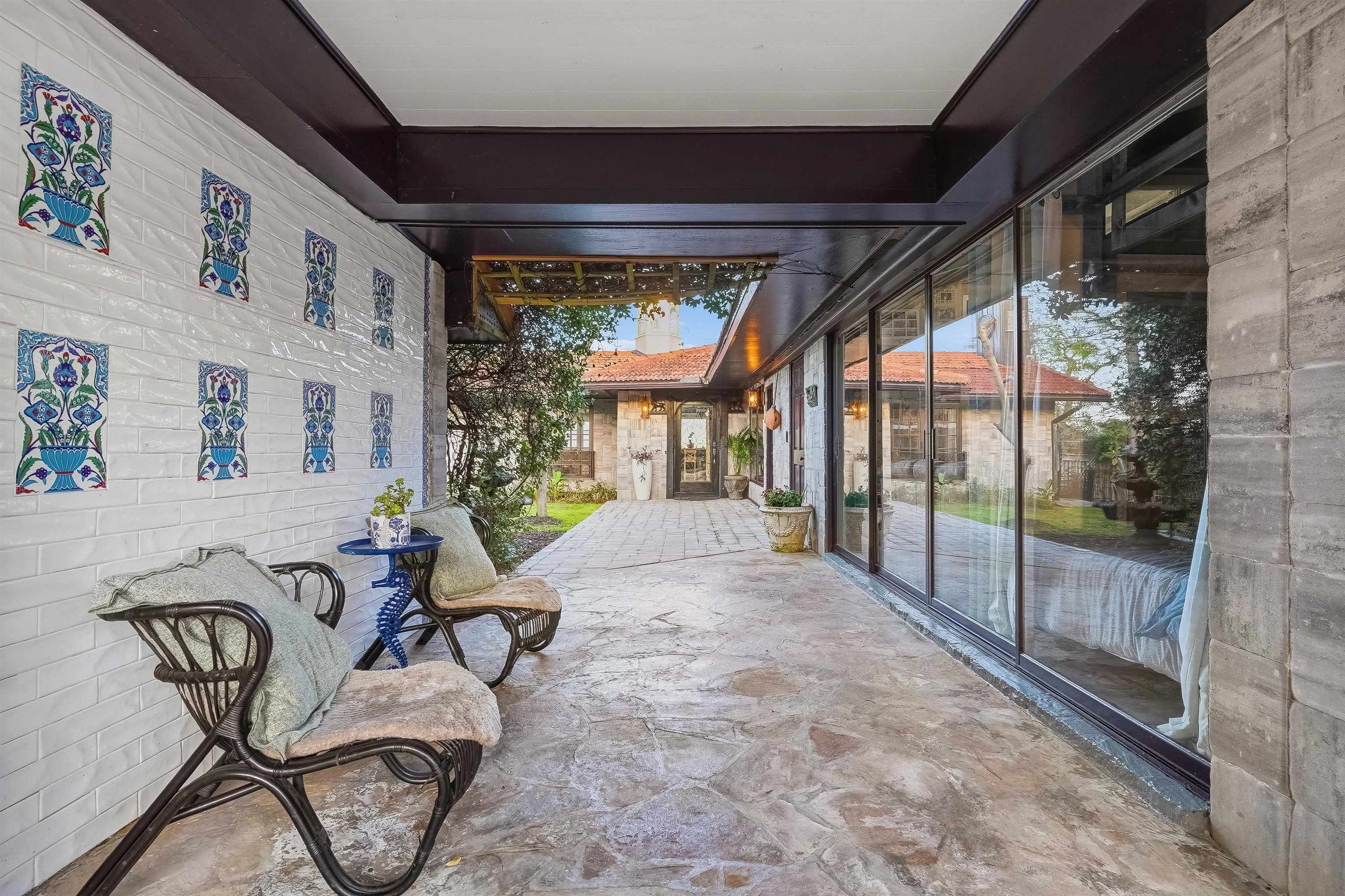 71 Water Street St. Augustine, FL 32084 - Photo 34 of 57 Sheltered patio to the front door. The painted tiles add vibrant color and style.