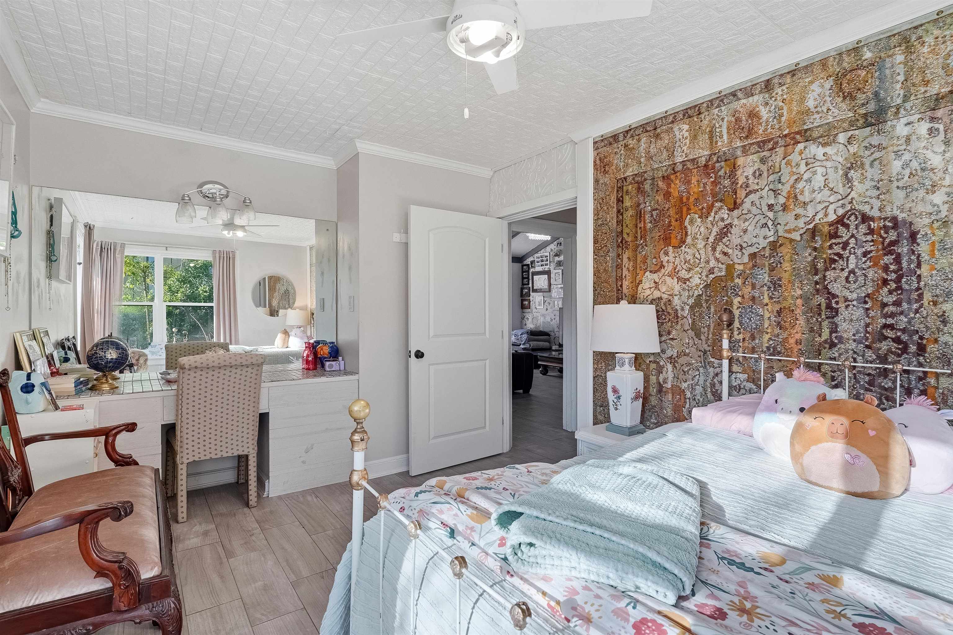 71 Water Street St. Augustine, FL 32084 - Photo 39 of 58 Bedroom with ornamental molding, light wood finished floors, and a ceiling fan.