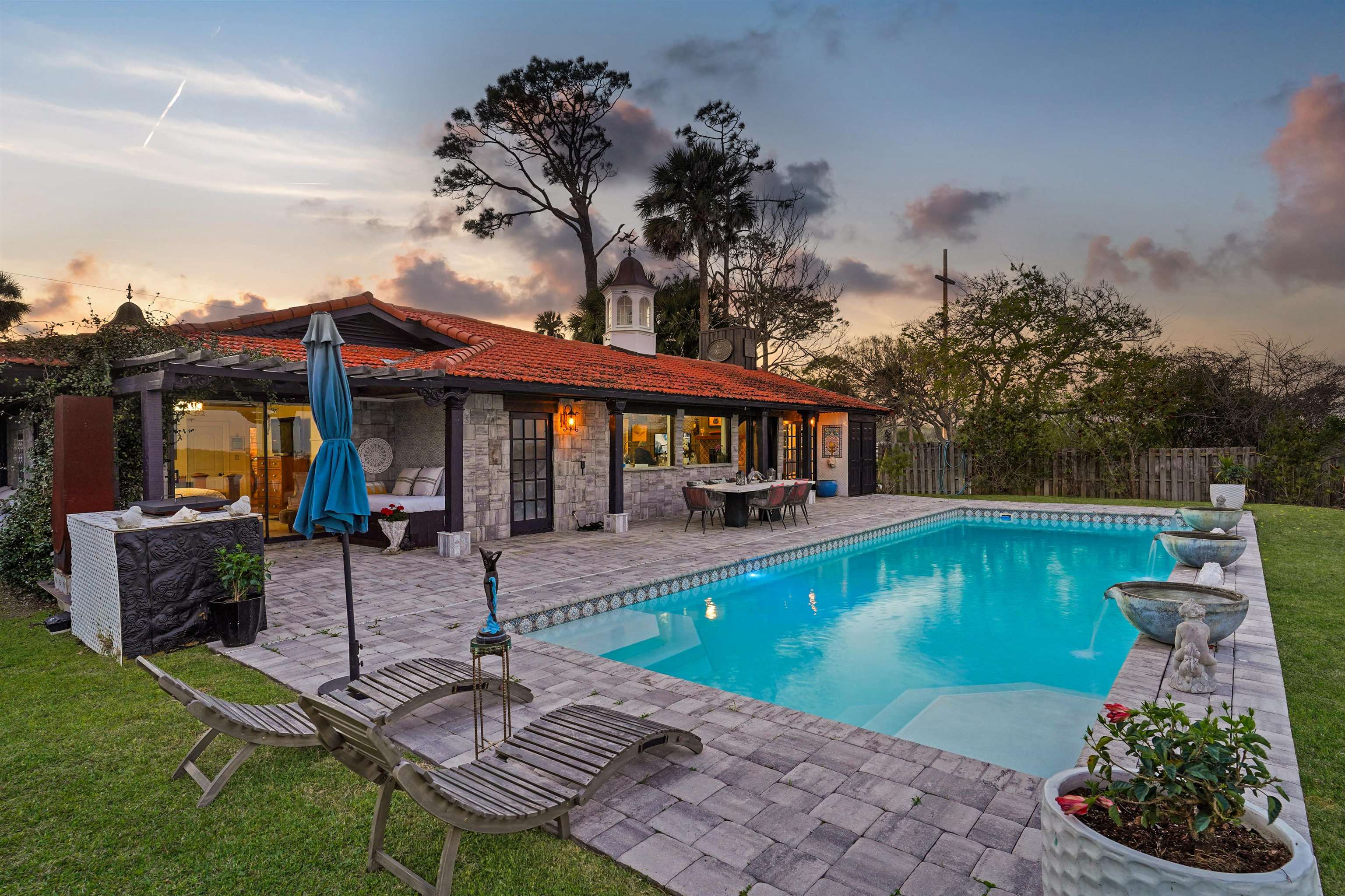 71 Water Street St. Augustine, FL 32084 - Photo 48 of 58 View of swimming pool with patio surround, a fenced backyard, outdoor dining area, and a pergola