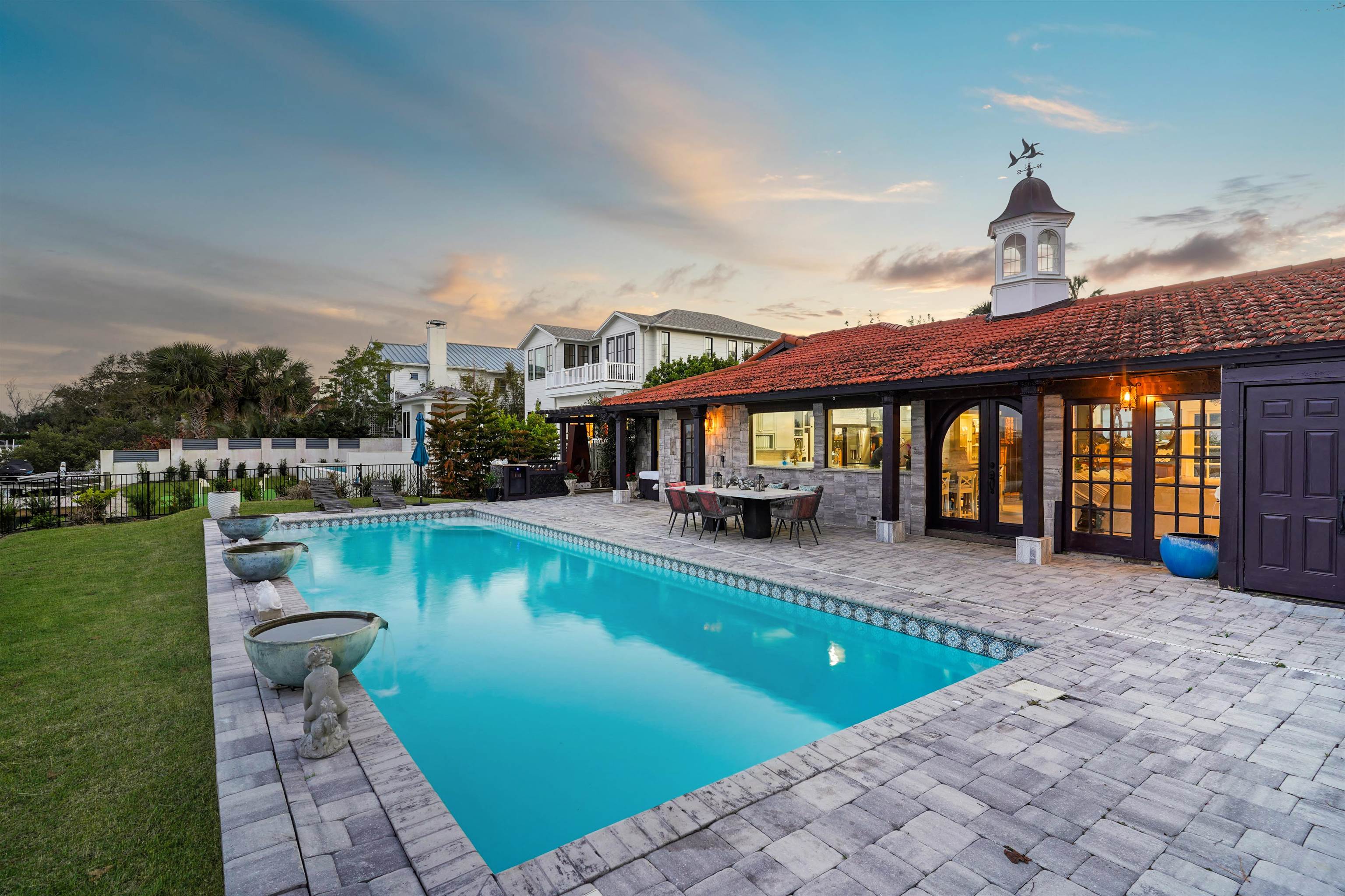 71 Water Street St. Augustine, FL 32084 - Photo 49 of 57 Pool at dusk featuring a patio area