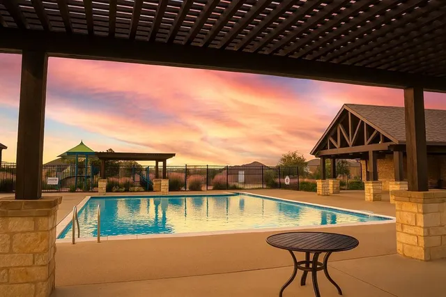 a view of swimming pool from a balcony