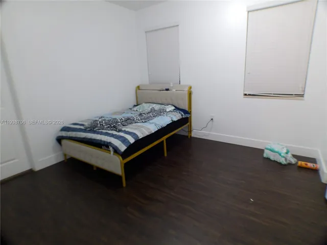 a bedroom with a bed and a table in it