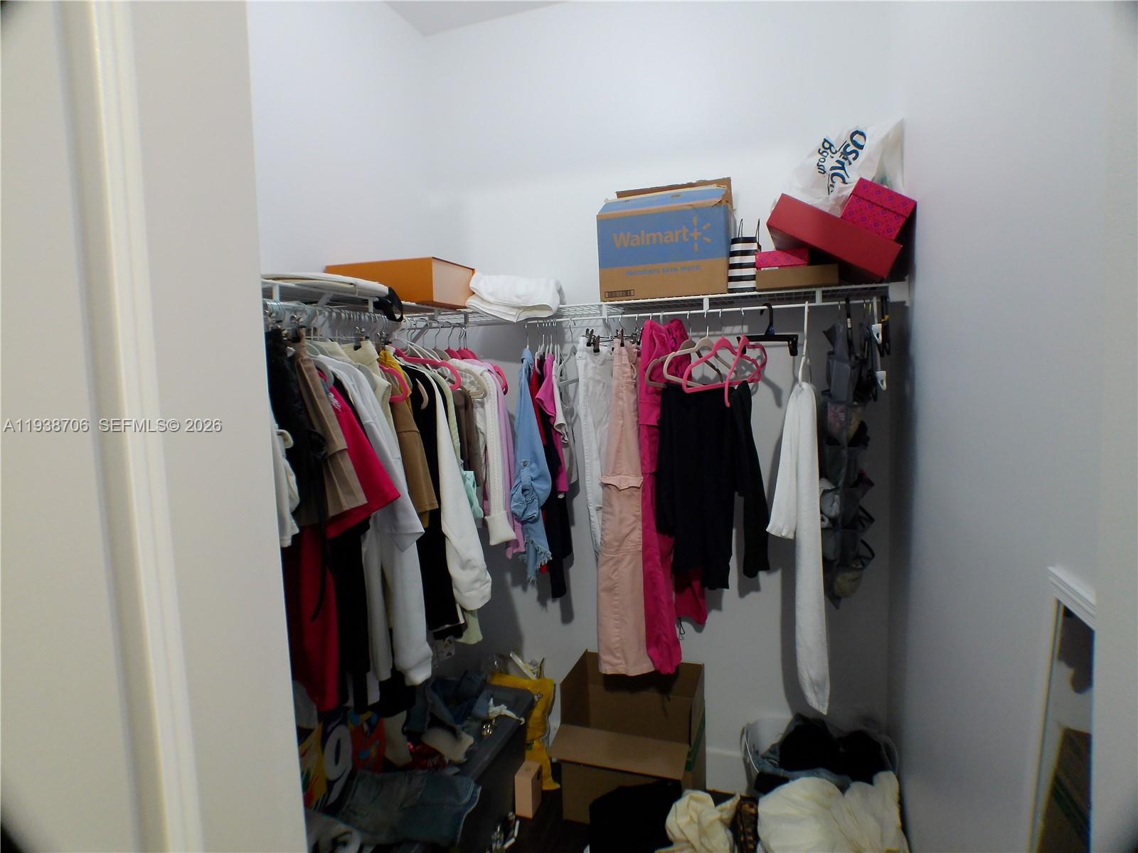 3308 West 95th Terrace Hialeah, FL 33018 - Photo 14 of 29 a view of walk in closet with clothes