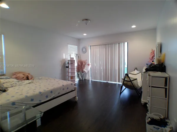 a bed room with a bed and a chandelier