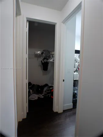 a view of a livingroom with furniture and hardwood floor