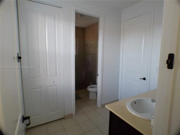 a bathroom with a tub and sink