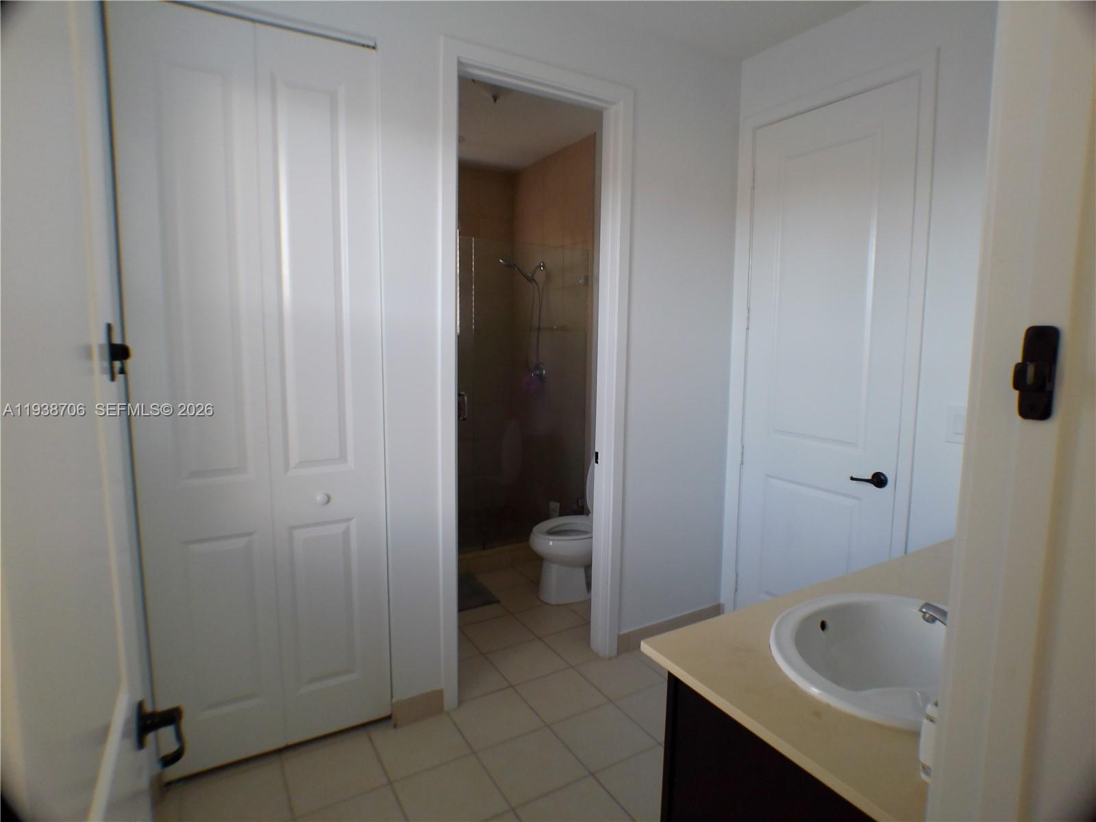 3308 West 95th Terrace Hialeah, FL 33018 - Photo 22 of 29 a bathroom with a tub and sink