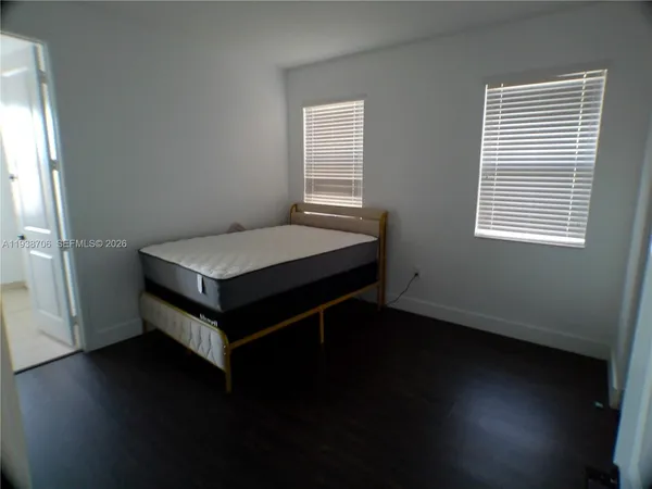 a room with a bed and a window