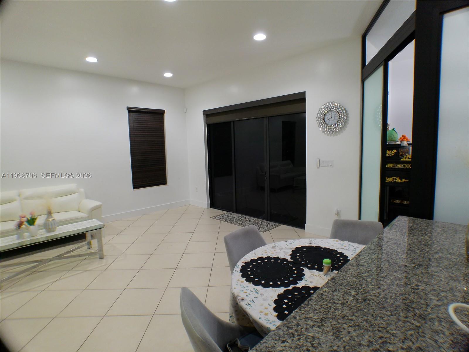 3308 West 95th Terrace Hialeah, FL 33018 - Photo 3 of 29 a hallway with a view of living room