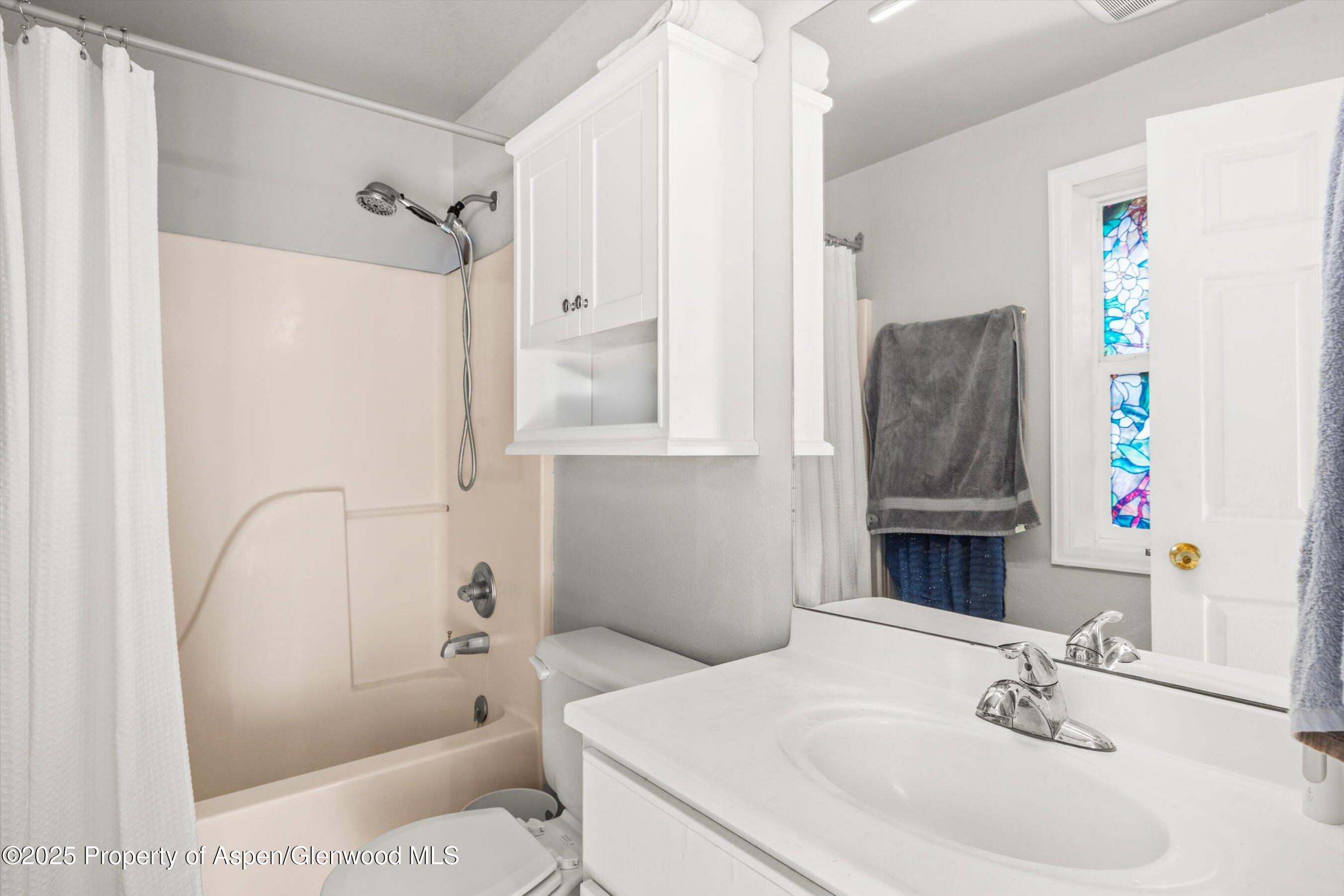 23284 2 Rivers Road, Unit 13 Basalt, CO 81621 - Photo 12 of 16 a bathroom with a sink toilet and shower