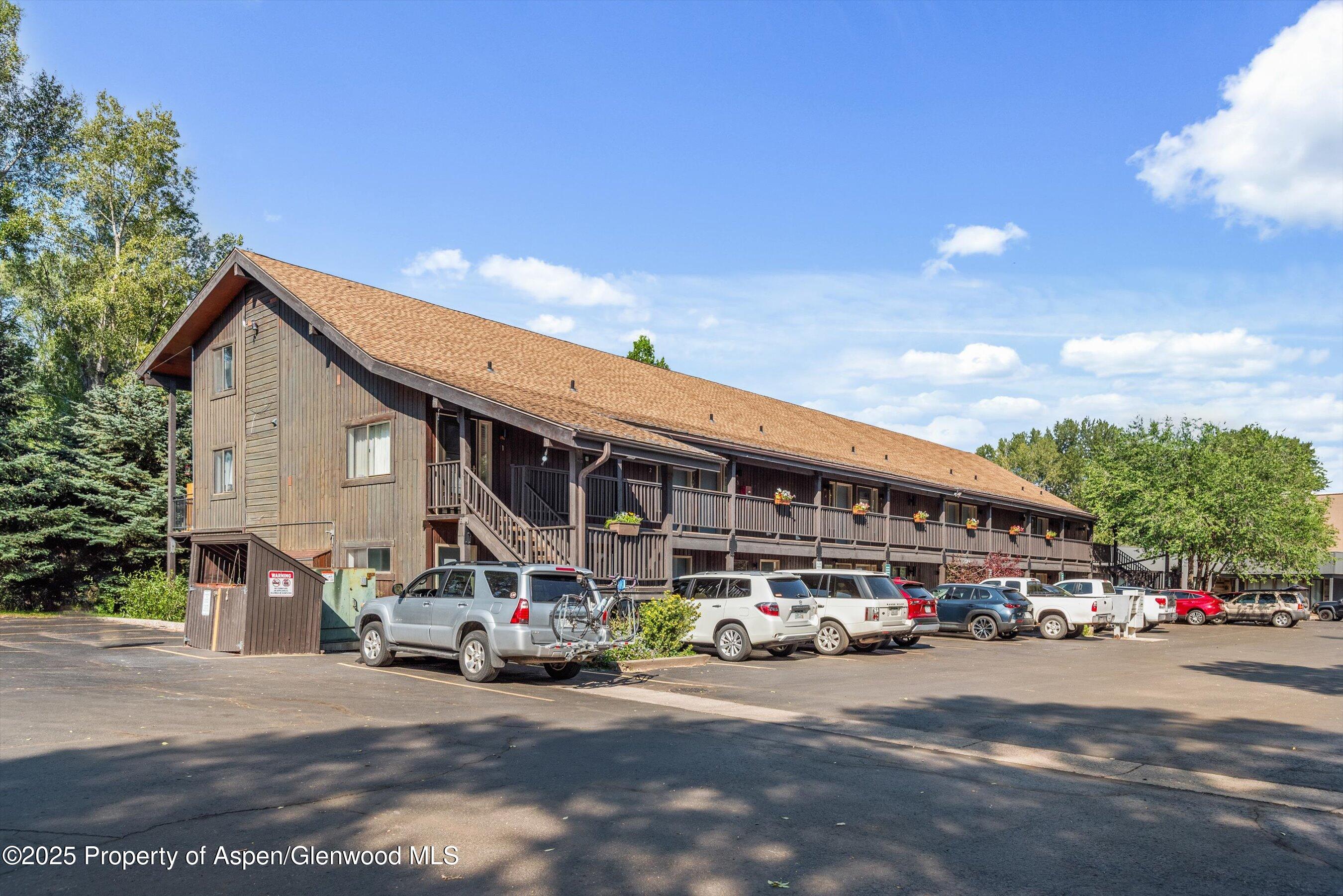 23284 2 Rivers Road, Unit 13 Basalt, CO 81621 - Photo 13 of 16 a car parked in front of the building