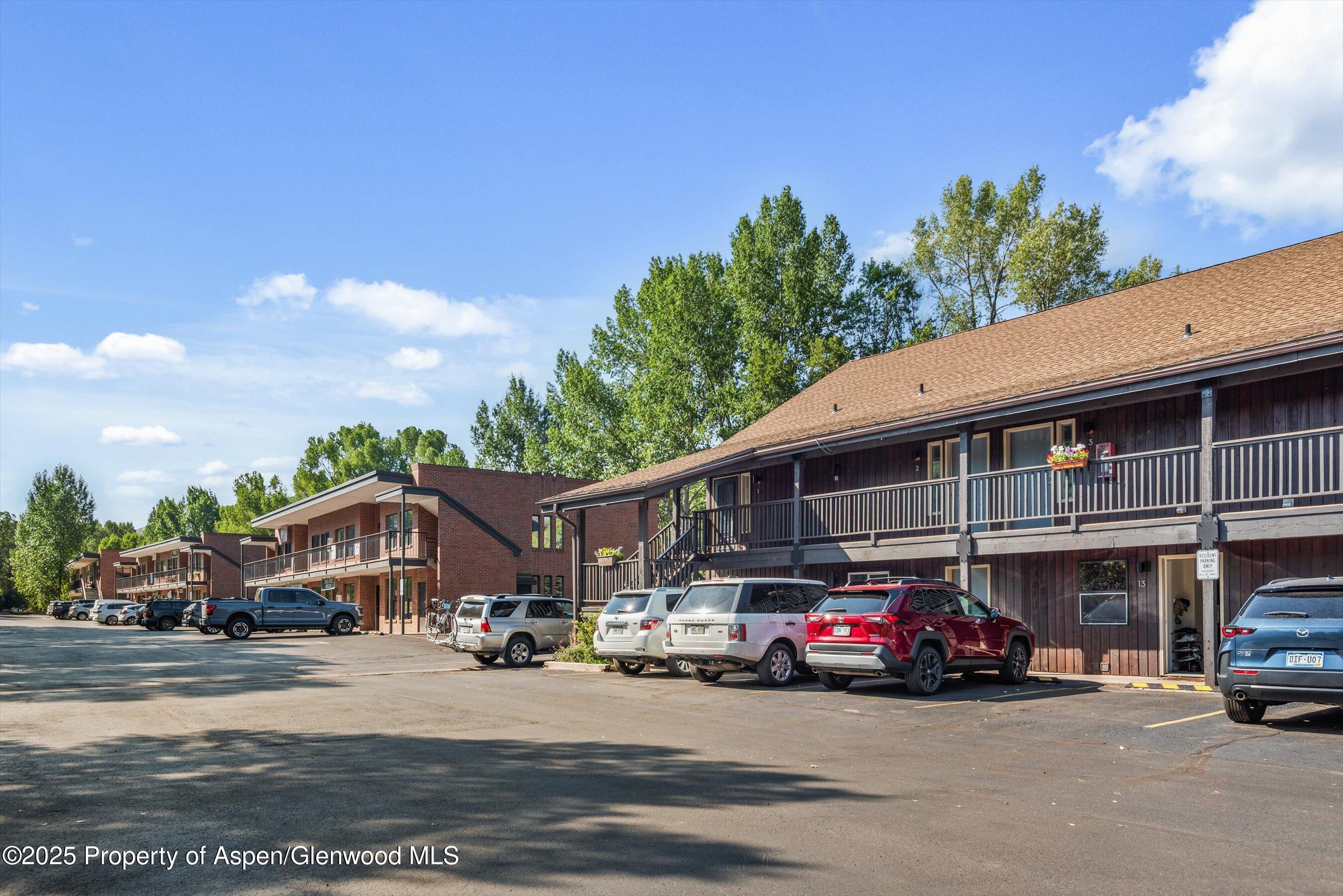 23284 2 Rivers Road, Unit 13 Basalt, CO 81621 - Photo 14 of 16 a car parked in front of a building