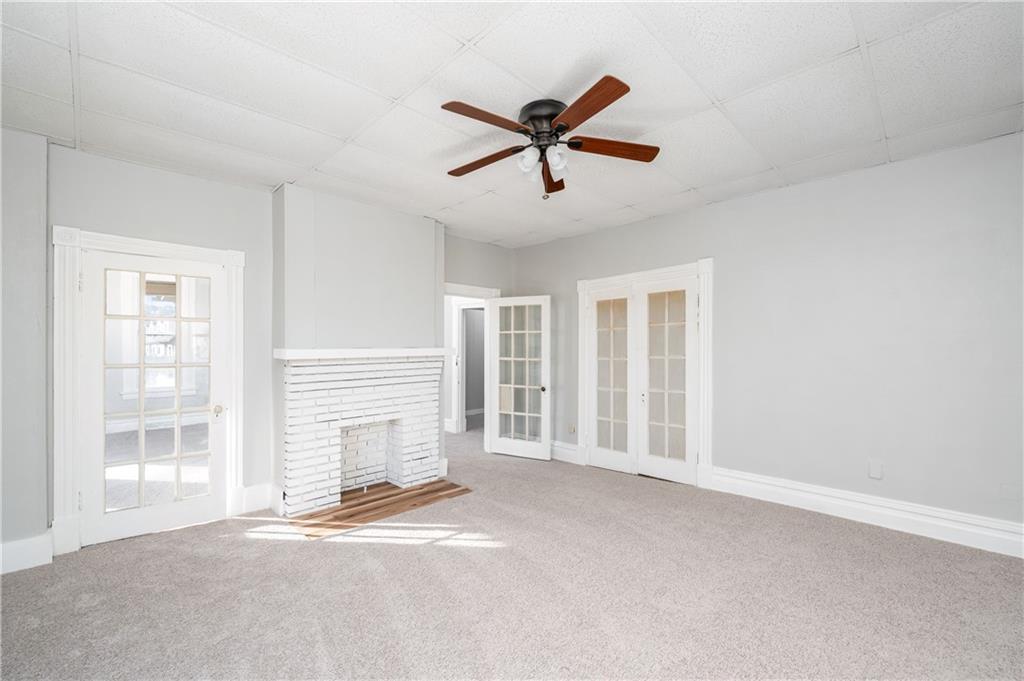 401 West New Castle Street Butler, PA 16001 - Photo 11 of 32 a view of a livingroom with a ceiling fan and window