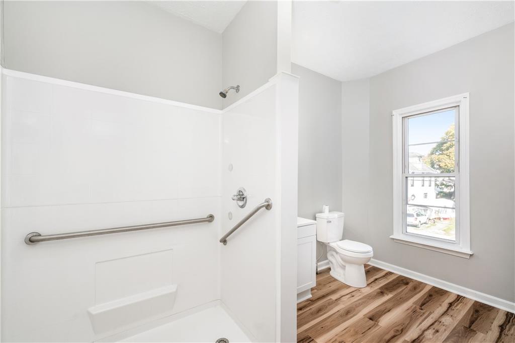 401 West New Castle Street Butler, PA 16001 - Photo 20 of 32 a bathroom with a toilet a sink and a window