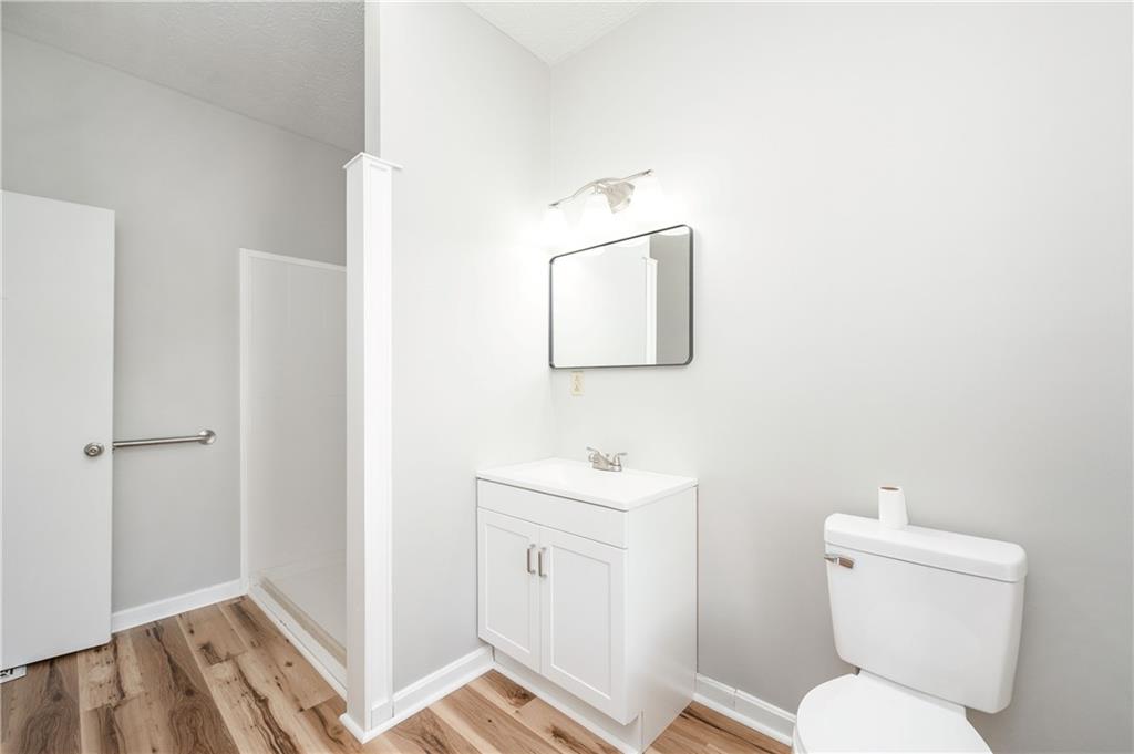 401 West New Castle Street Butler, PA 16001 - Photo 21 of 32 a bathroom with a toilet sink and a mirror