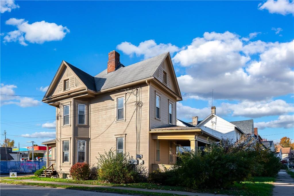 401 West New Castle Street Butler, PA 16001 - Photo 3 of 32 a front view of a house with a yard and fountain