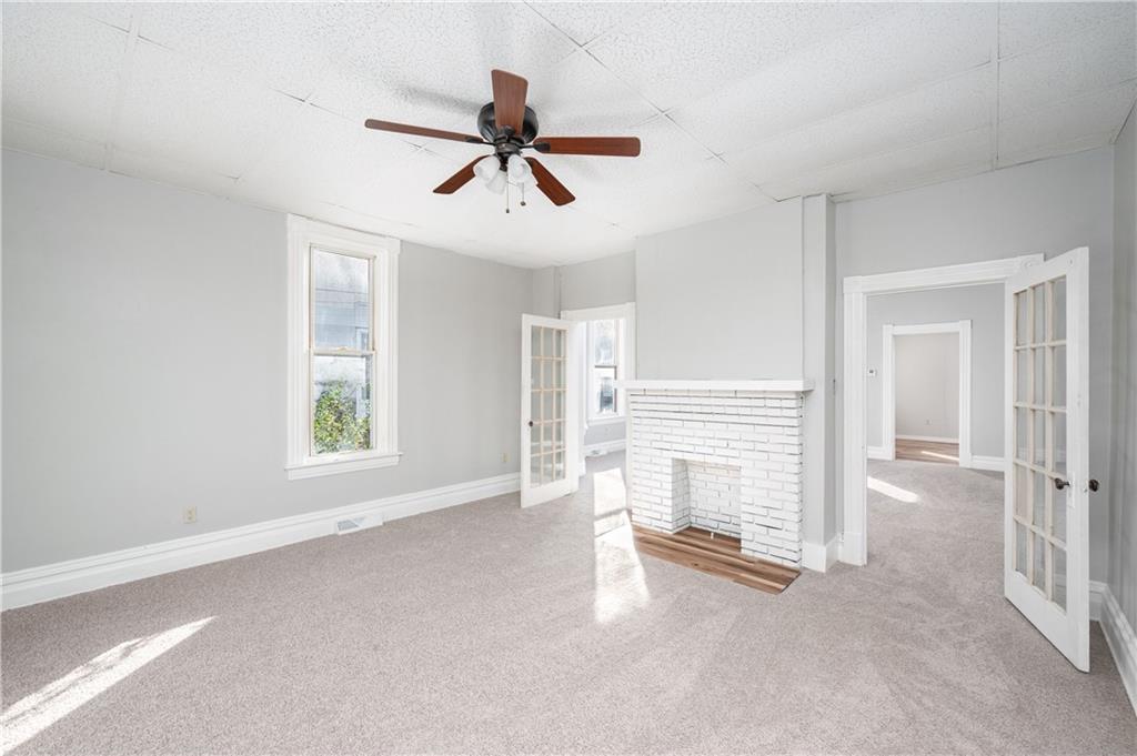 401 West New Castle Street Butler, PA 16001 - Photo 10 of 32 a view of a livingroom with a ceiling fan and window