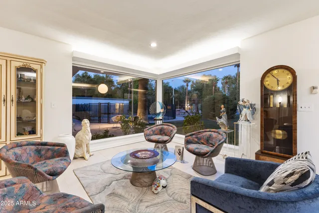 a bathroom with a granite countertop sink a toilet and mirror