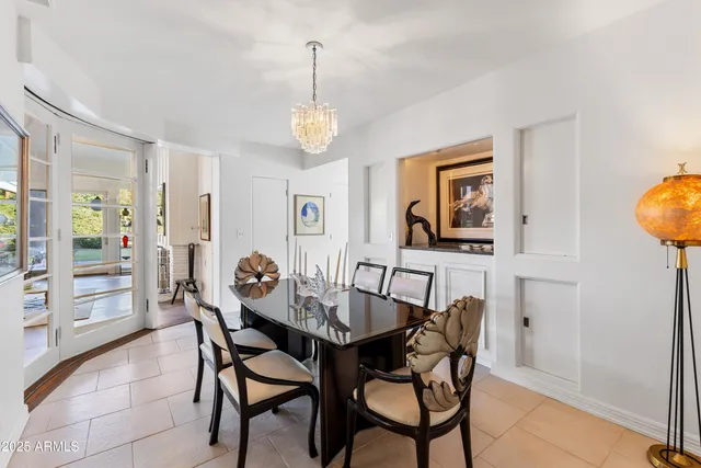 a lobby with furniture and floor to ceiling window