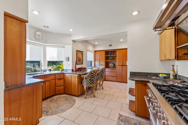 a bathroom with a sink mirror and toilet