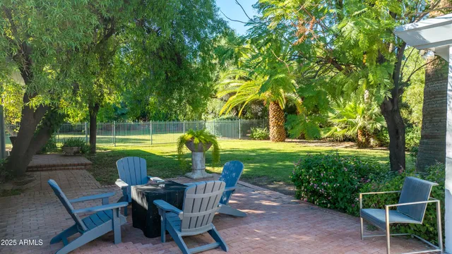 a view of a table and chairs in the garden
