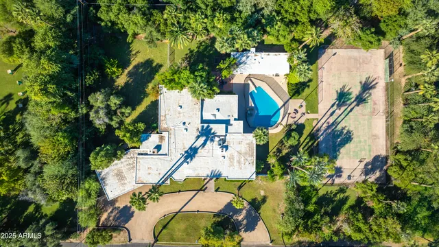 a view of a patio with table and chairs and potted plants