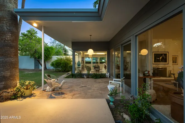 a view of swimming pool with outdoor seating