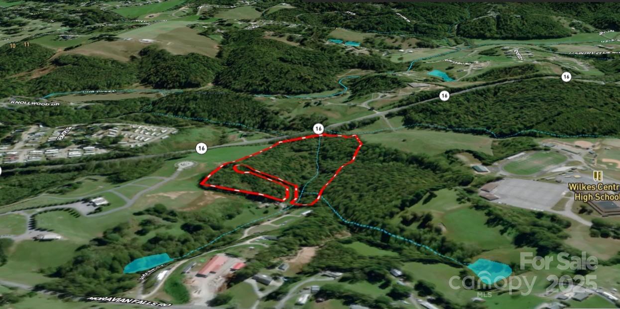 701 Moravian Falls Road Wilkesboro, NC 28697 - Photo 4 of 30 an aerial view of a houses with outdoor space and street view