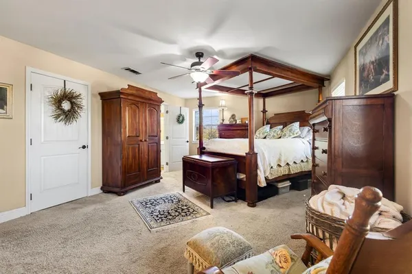 a bedroom with furniture and a chandelier
