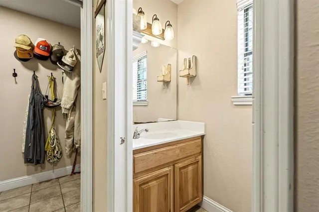 a bathroom with a sink and a mirror