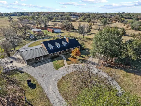 an aerial view of a house with a swimming pool