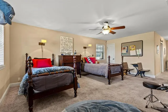 a bedroom with furniture and a chandelier