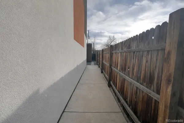 a balcony with wooden fence