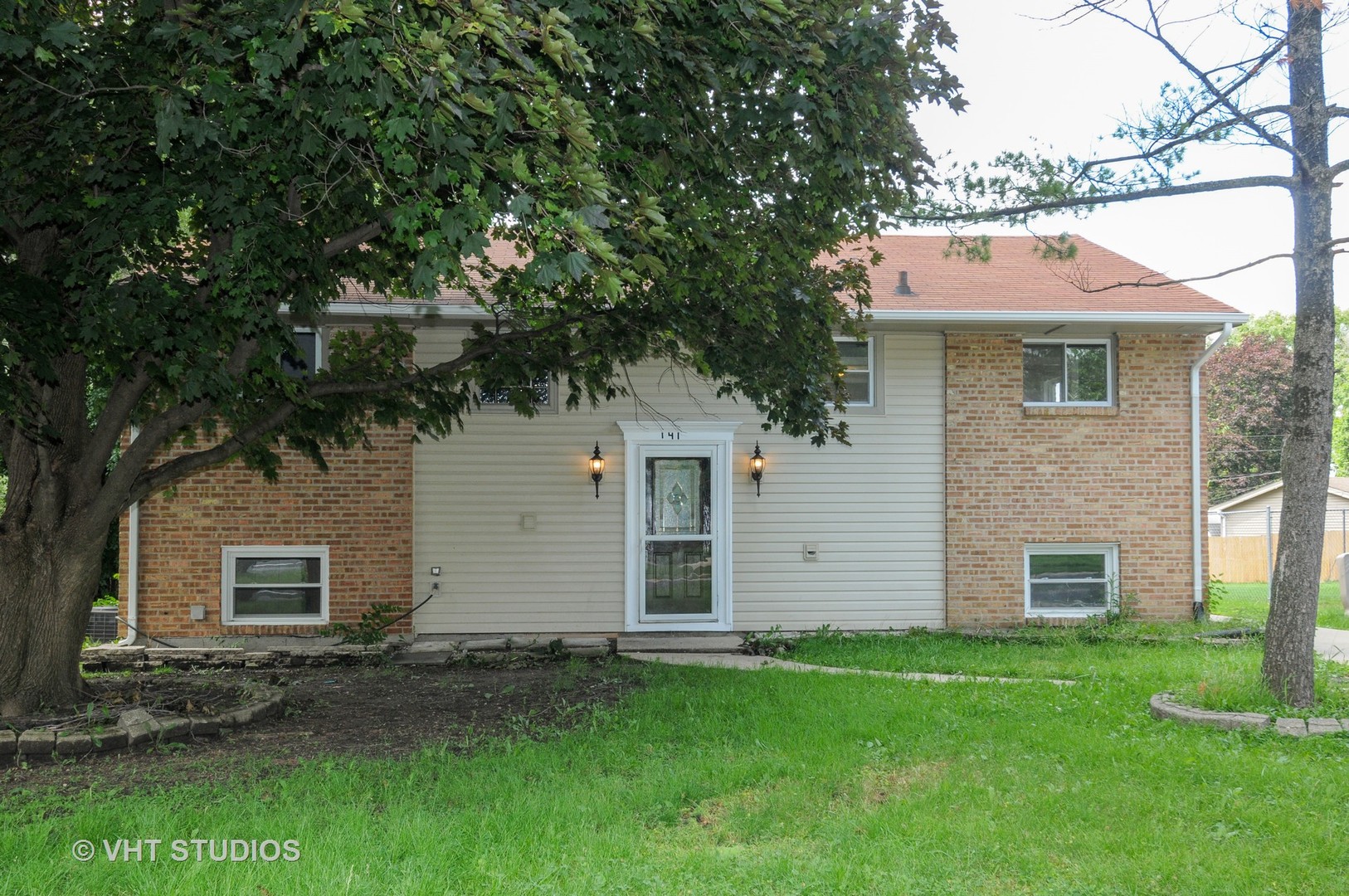 141 Oxford Road Bolingbrook, IL 60440 - Photo 1 of 12 front view of house with a yard