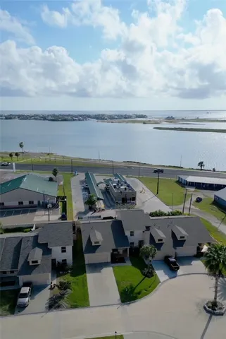 an aerial view of a terrace with lawn chairs