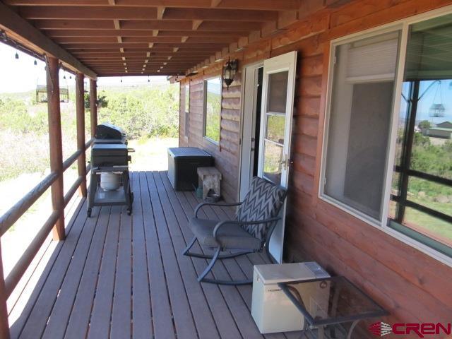 21578 Highway 65 Cedaredge, CO 81413 - Photo 16 of 35 a living room with furniture and a large window