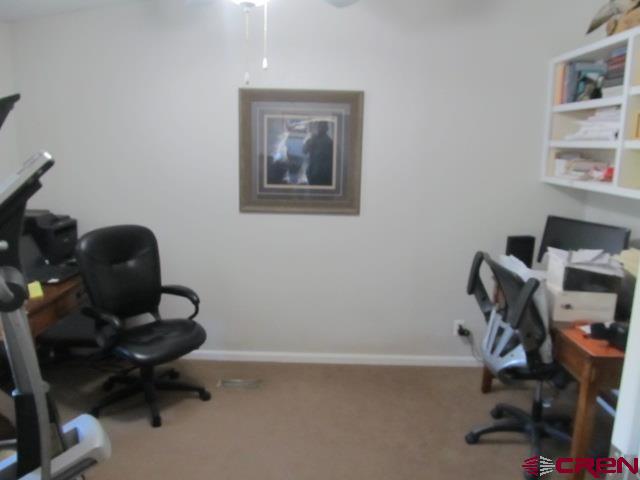 21578 Highway 65 Cedaredge, CO 81413 - Photo 25 of 35 a view of a workspace with furniture and a window