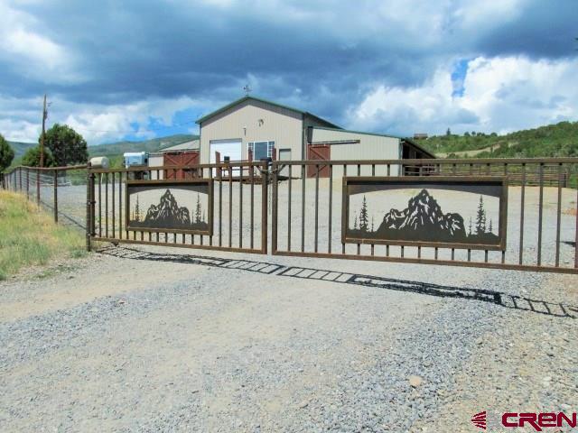 21578 Highway 65 Cedaredge, CO 81413 - Photo 3 of 35 a view of a street with a sign board