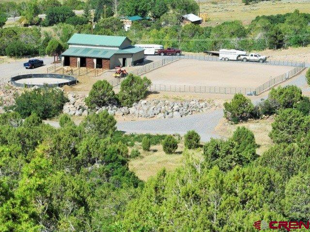 21578 Highway 65 Cedaredge, CO 81413 - Photo 35 of 35 an aerial view of a house with garden space and street view
