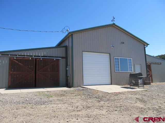 21578 Highway 65 Cedaredge, CO 81413 - Photo 4 of 35 a view of a house with a backyard