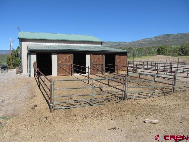 21578 Highway 65 Cedaredge, CO 81413 - Photo 7 of 35 a view of a house with a snow on the road