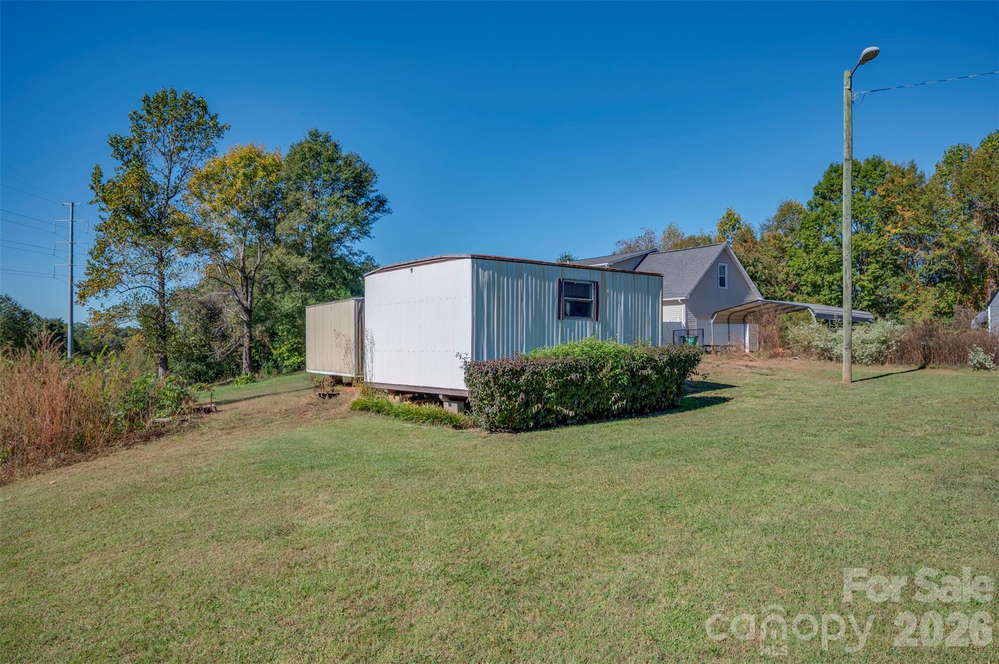 506 Pleasant Street Spindale, NC 28160 - Photo 34 of 42 a view of a house with backyard and trees