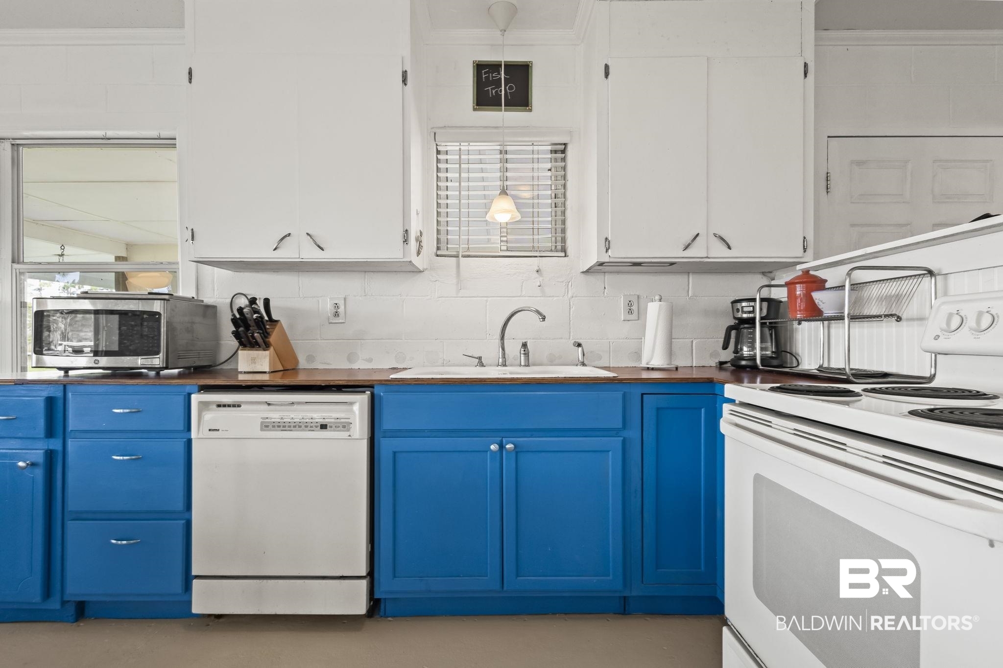 7849 Bayshore Drive Elberta, AL 36530 - Photo 20 of 47 Kitchen featuring white appliances, blue cabinets, sink, and white cabinetry