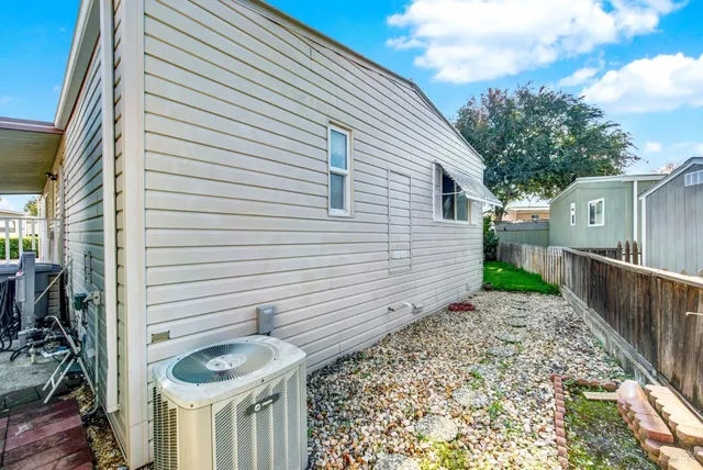 a living room with furniture fireplace and a window