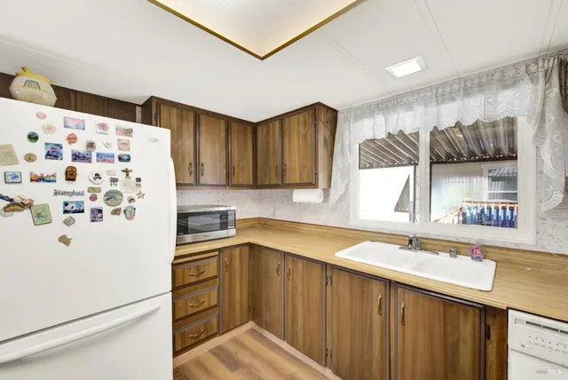 a view of a workspace with furniture and a workspace