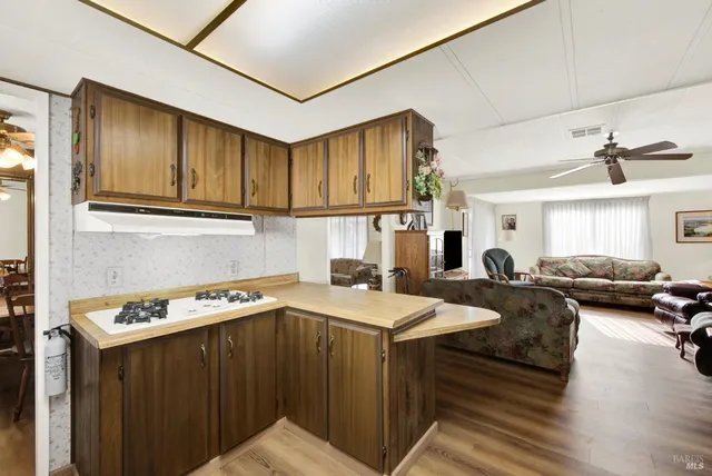 a view of a workspace with furniture and a fireplace