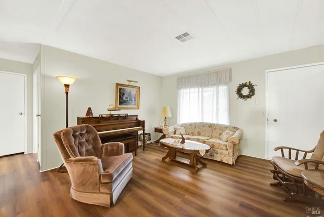 a view of cabinets and wooden floor