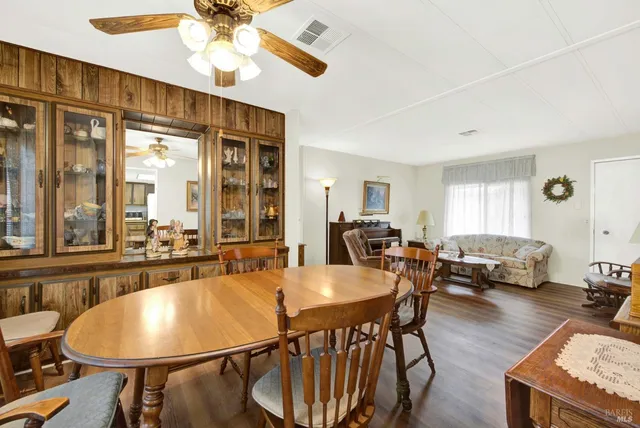a view of a house with a big yard and potted plants